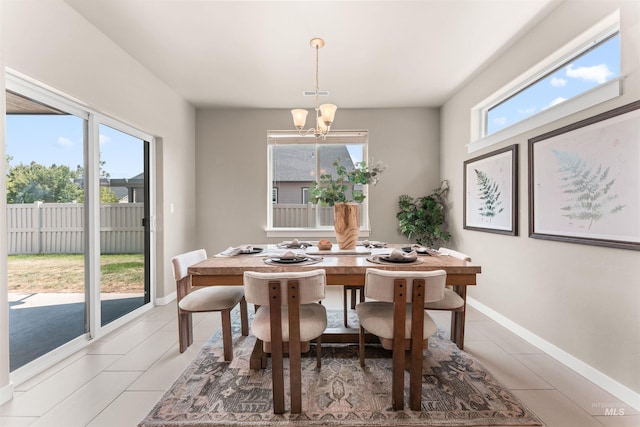 12457 W Awbrey St, Boise, ID 83709 - dining area featuring a chandelier and light tile patterned flooring