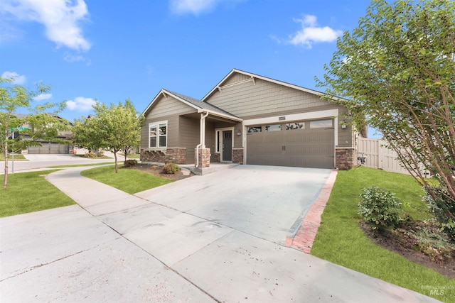 12457 W Awbrey St, Boise, ID 83709 - craftsman-style house with a garage, stone siding, and driveway