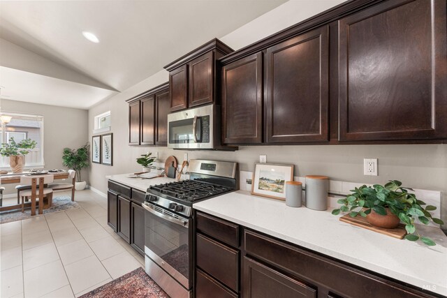 12457 W Awbrey St, Boise, ID 83709 - kitchen with appliances with stainless steel finishes, light countertops, lofted ceiling, dark brown cabinetry, and recessed lighting