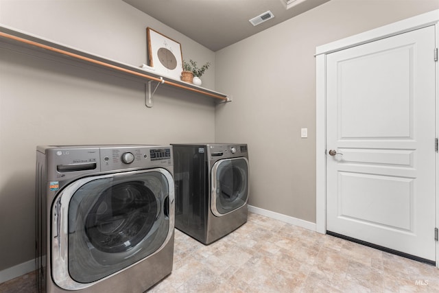 12457 W Awbrey St, Boise, ID 83709 - laundry area with separate washer and dryer and baseboards