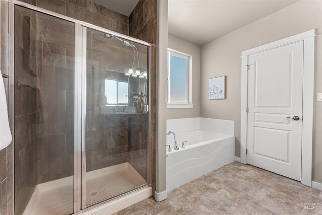 12457 W Awbrey St, Boise, ID 83709 - bathroom featuring a garden tub and a shower stall