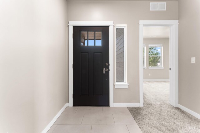 12457 W Awbrey St, Boise, ID 83709 - foyer entrance with light colored carpet and light tile patterned floors