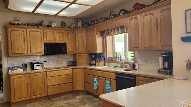 kitchen featuring backsplash, sink, and black appliances