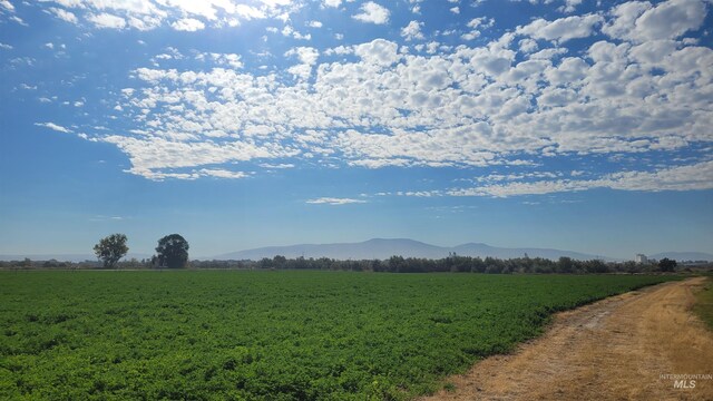 mountain view featuring a rural view