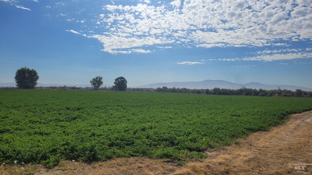 mountain view featuring a rural view