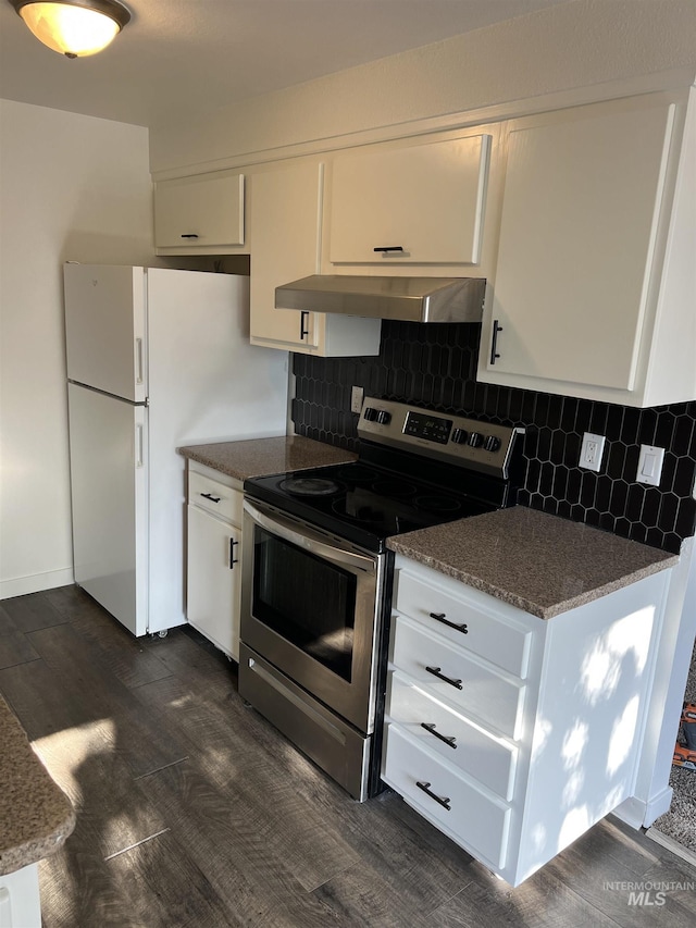 kitchen featuring freestanding refrigerator, exhaust hood, stainless steel electric stove, and white cabinets