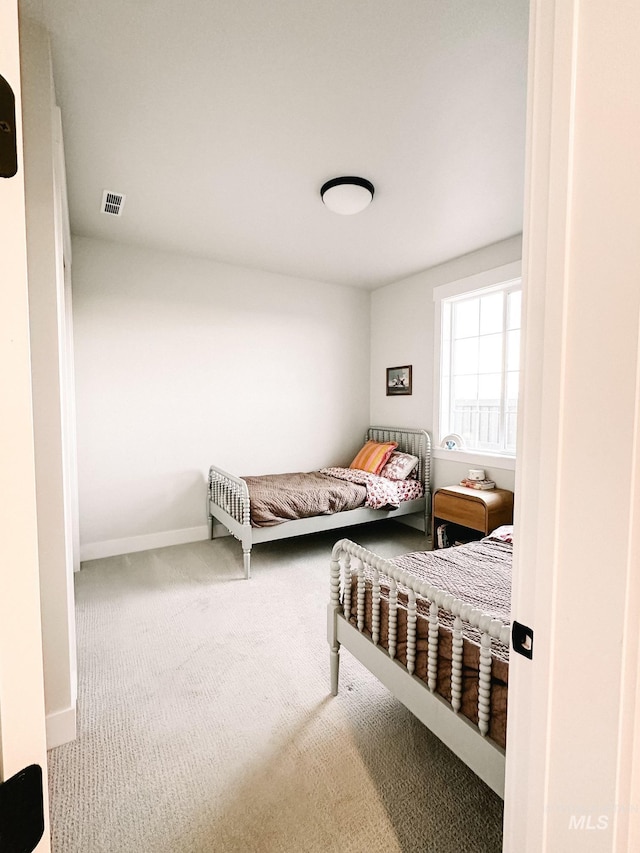 bedroom featuring carpet