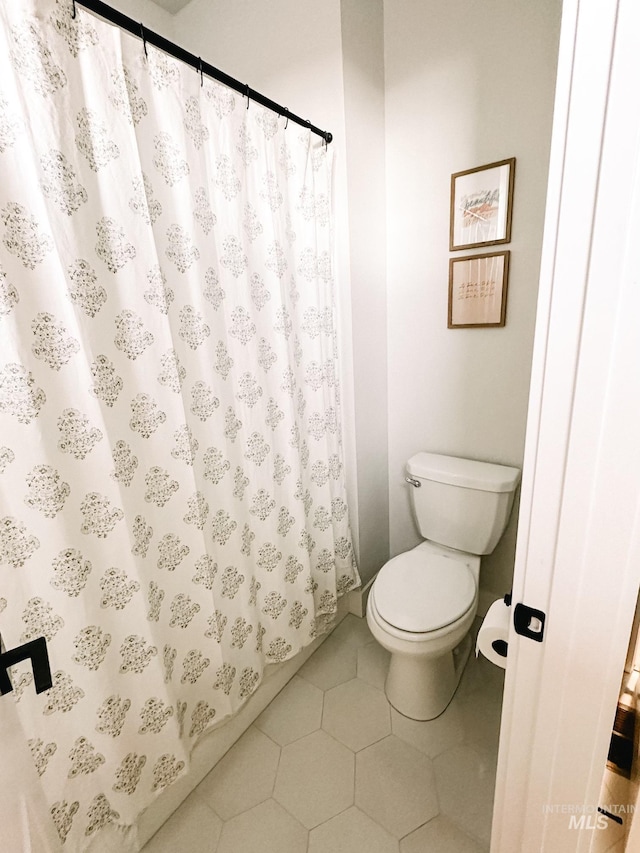 bathroom featuring tile patterned floors and toilet