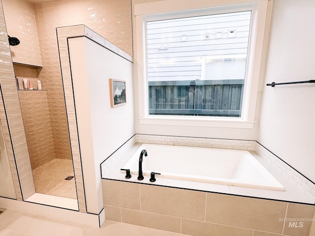 bathroom featuring tile patterned floors and plus walk in shower