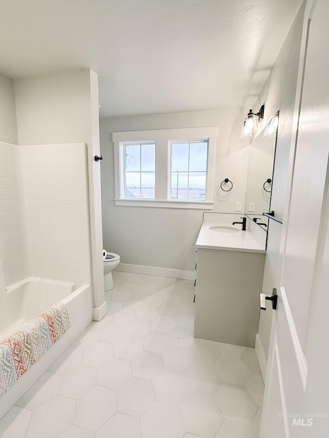 full bathroom featuring tile patterned flooring, vanity, toilet, and shower / washtub combination