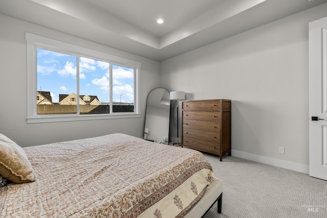 bedroom featuring light colored carpet