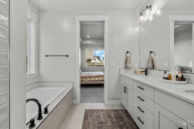 bathroom with vanity, tile patterned floors, and a bathing tub