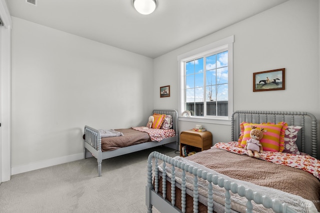 bedroom with light colored carpet