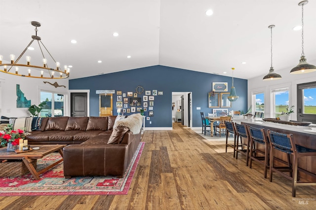 1400 Texas Ridge Rd, Deary, ID 83823 - living area featuring a chandelier, wood finished floors, lofted ceiling, and plenty of natural light