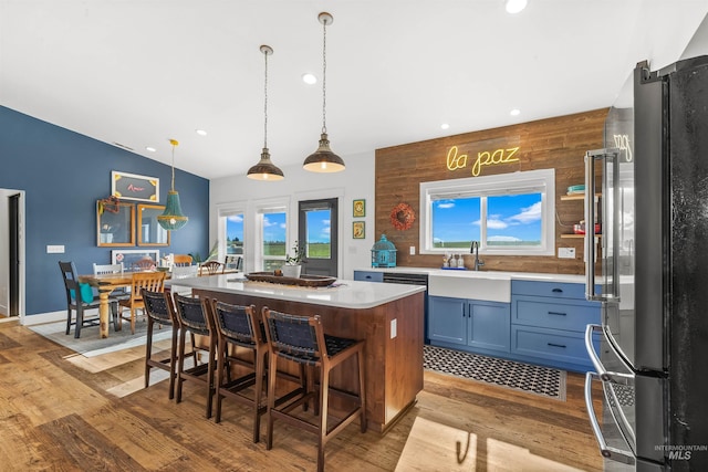 1400 Texas Ridge Rd, Deary, ID 83823 - kitchen with light countertops, a center island, freestanding refrigerator, and light wood finished floors