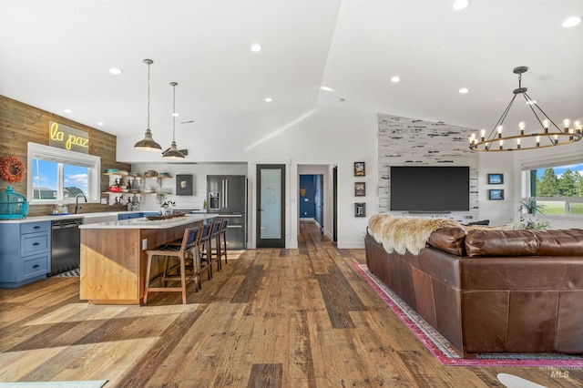 1400 Texas Ridge Rd, Deary, ID 83823 - kitchen featuring vaulted ceiling, a kitchen island, high end refrigerator, dishwasher, and open floor plan