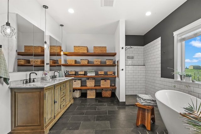1400 Texas Ridge Rd, Deary, ID 83823 - full bath with a freestanding bath, a walk in shower, a sink, and visible vents