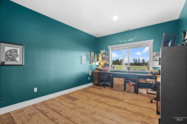 1400 Texas Ridge Rd, Deary, ID 83823 - office area featuring visible vents, baseboards, and wood finished floors