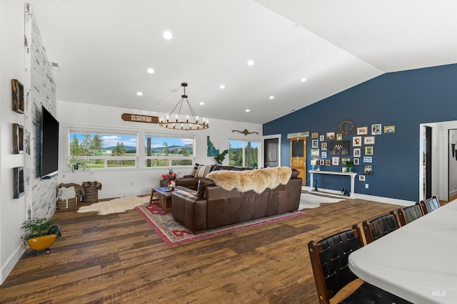 1400 Texas Ridge Rd, Deary, ID 83823 - living area featuring wood finished floors, a notable chandelier, lofted ceiling, and plenty of natural light