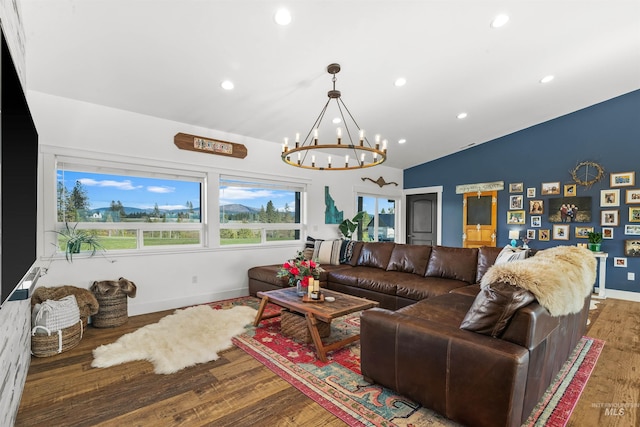 1400 Texas Ridge Rd, Deary, ID 83823 - living room with an inviting chandelier, recessed lighting, wood finished floors, lofted ceiling, and baseboards