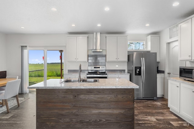 12798 King Rd, Kendrick, ID 83537 - kitchen with wall chimney exhaust hood, appliances with stainless steel finishes, a sink, recessed lighting, and dark wood-type flooring