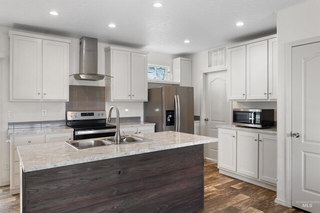 12798 King Rd, Kendrick, ID 83537 - kitchen featuring wall chimney exhaust hood, appliances with stainless steel finishes, a sink, dark wood-type flooring, and light countertops