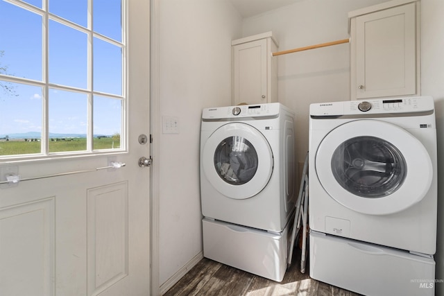 12798 King Rd, Kendrick, ID 83537 - laundry room with separate washer and dryer, cabinet space, and dark wood-type flooring