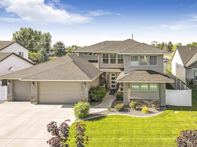 prairie-style house with a garage and a front yard