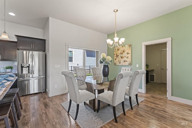 18277 N Streams Edge Way, Boise, ID 83714 - dining area featuring a chandelier, wood finished floors, baseboards, and recessed lighting