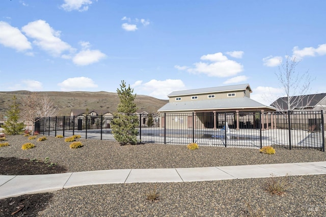 18277 N Streams Edge Way, Boise, ID 83714 - view of front of house featuring a patio area, a mountain view, and metal roof