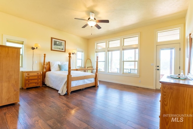 bedroom with ceiling fan and dark hardwood / wood-style flooring