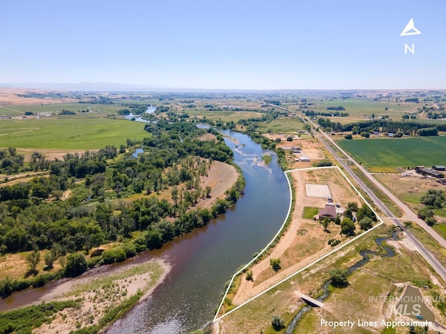 aerial view with a water view and a rural view