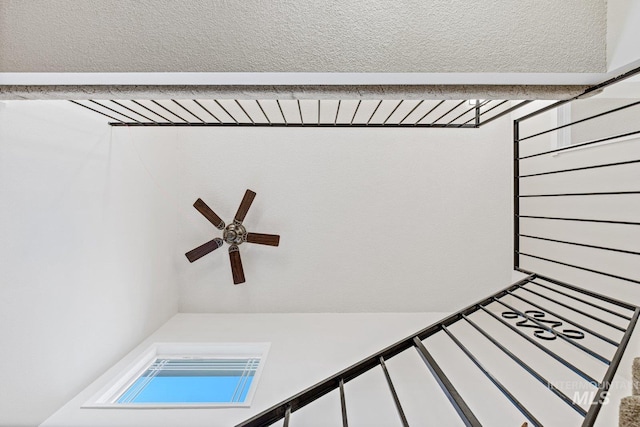 interior details featuring ceiling fan