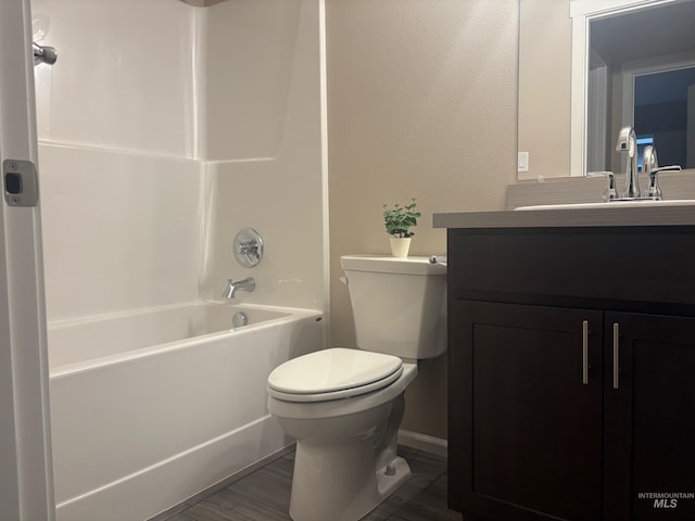 full bathroom featuring shower / bath combination, vanity, wood-type flooring, and toilet