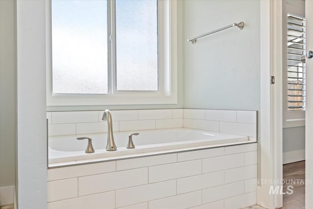 full bath with a garden tub