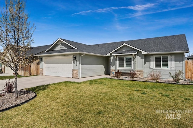 ranch-style home with fence, stone siding, driveway, a front yard, and a garage