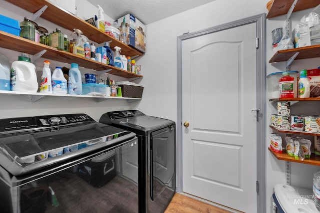 1056 S Hebgon Lake Ave, Middleton, ID 83644 - laundry area with independent washer and dryer and light wood-style floors