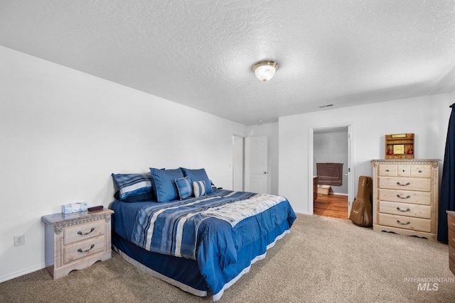 1056 S Hebgon Lake Ave, Middleton, ID 83644 - carpeted bedroom featuring a textured ceiling and ensuite bathroom