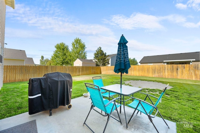 1056 S Hebgon Lake Ave, Middleton, ID 83644 - fenced backyard featuring grilling area, a patio area, and outdoor dining area