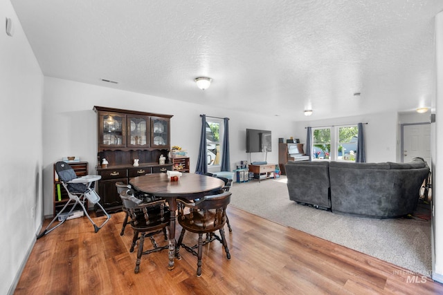 1056 S Hebgon Lake Ave, Middleton, ID 83644 - dining room featuring wood finished floors and a textured ceiling