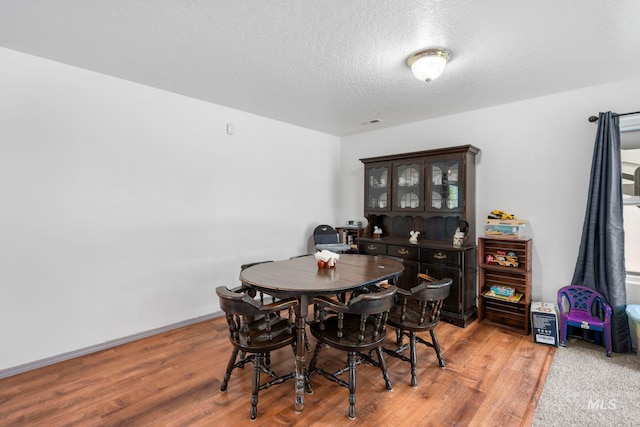 1056 S Hebgon Lake Ave, Middleton, ID 83644 - dining area featuring light wood-style floors and a textured ceiling