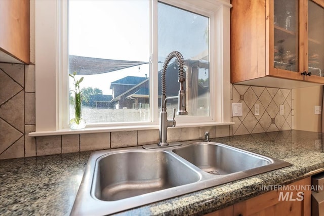 3052 N Christian Way, Meridian, ID 83646 - kitchen view of decorative backsplash, glass insert cabinets, and brown cabinets