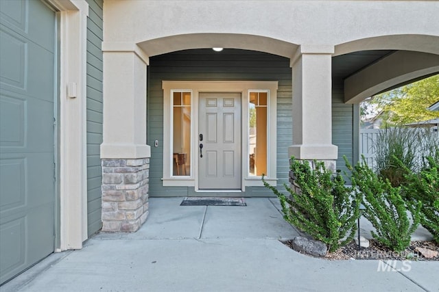 3052 N Christian Way, Meridian, ID 83646 - doorway to property featuring stucco siding and stone siding