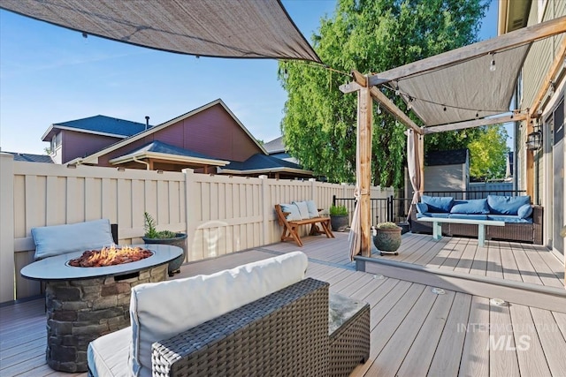 3052 N Christian Way, Meridian, ID 83646 - wooden deck with an outdoor living space with a fire pit and a fenced backyard