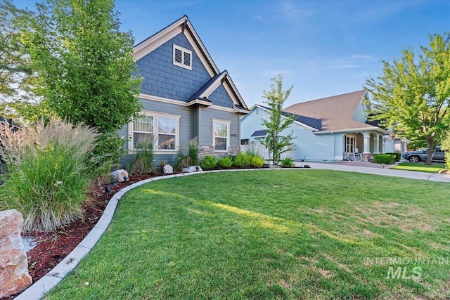 3052 N Christian Way, Meridian, ID 83646 - craftsman inspired home with a front yard and stone siding