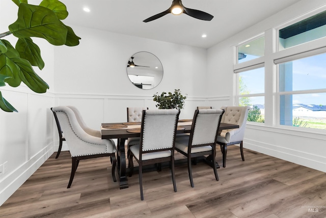 11127 Lake Lowell Ave, Nampa, ID 83686 - dining space featuring a decorative wall, a ceiling fan, wood finished floors, a wainscoted wall, and recessed lighting