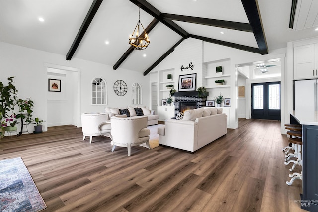 11127 Lake Lowell Ave, Nampa, ID 83686 - living area with wood finished floors, a glass covered fireplace, a chandelier, built in features, and recessed lighting