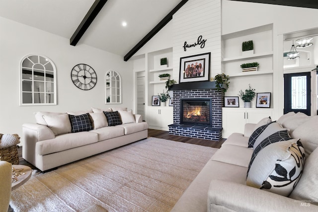11127 Lake Lowell Ave, Nampa, ID 83686 - living area featuring wood finished floors, built in features, and a tiled fireplace