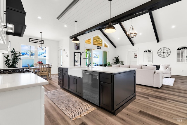 11127 Lake Lowell Ave, Nampa, ID 83686 - kitchen with dishwasher, a sink, a chandelier, light countertops, and wood finished floors