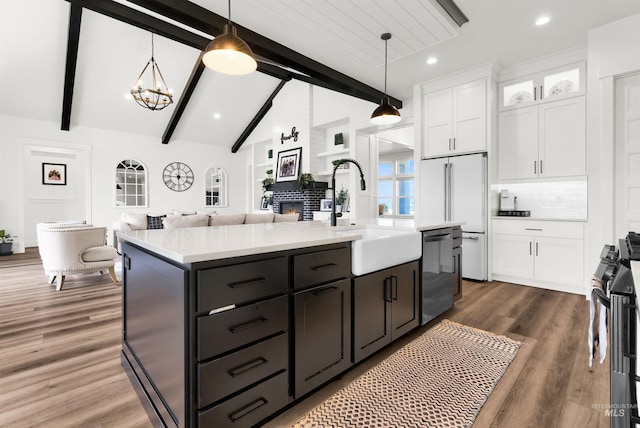 11127 Lake Lowell Ave, Nampa, ID 83686 - kitchen featuring dishwasher, white cabinetry, a sink, black range oven, and light countertops